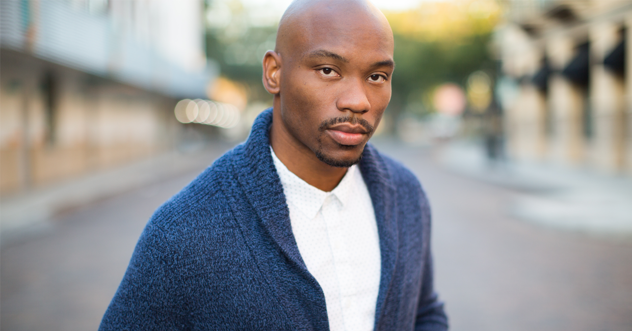 close up photograph of young guy with sweater